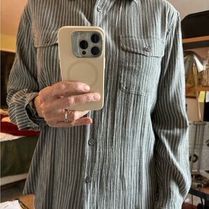 Laura Scott grey pin-striped women’s blouse. It has a strap to wear sleeves 3/4